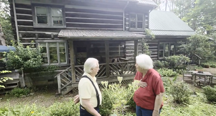 The famous log cabin with timbers from 1800, with Alton Medlin